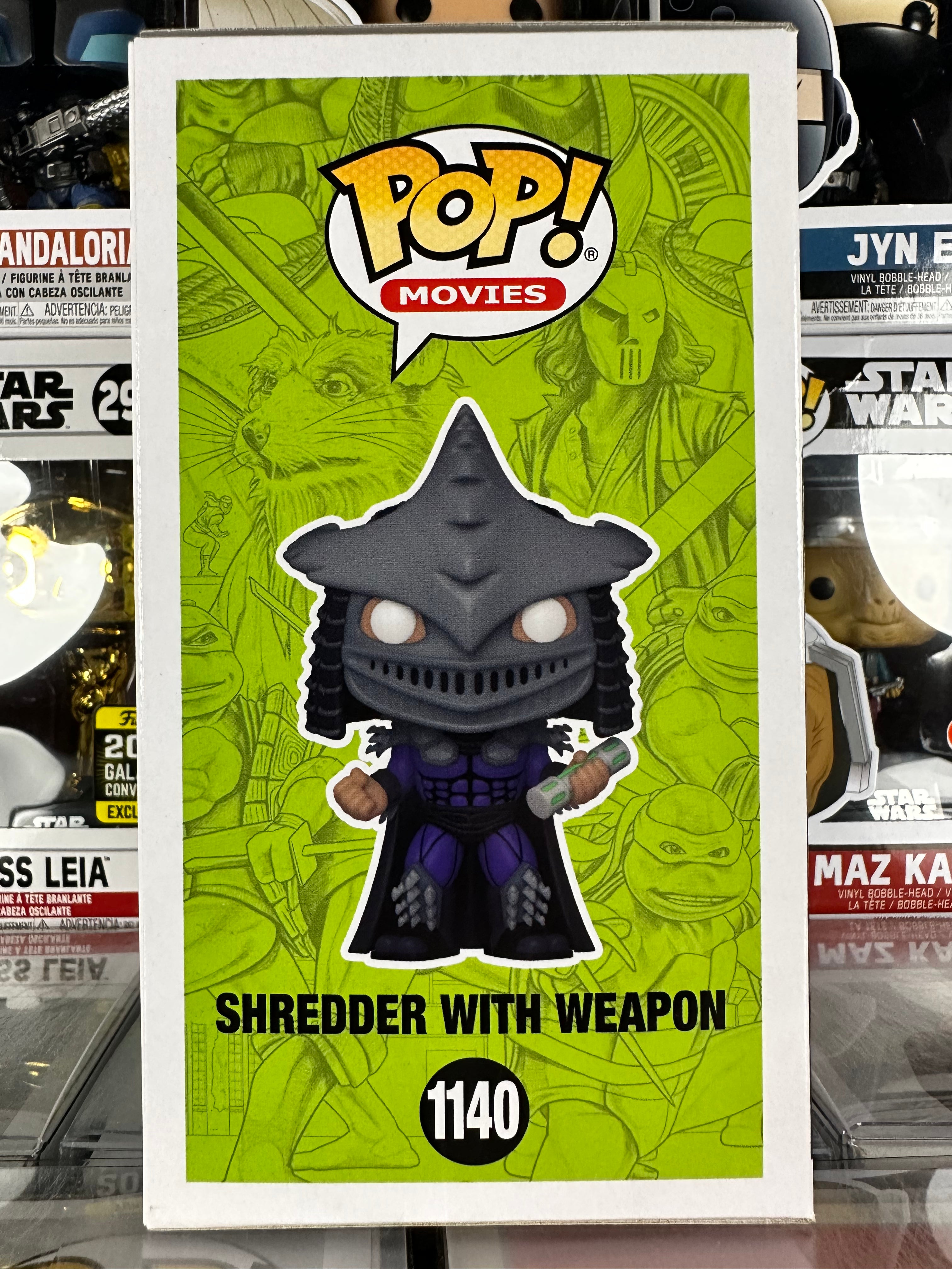 Funko Pop! Movies Teenage Mutant Ninja Turtles #1140 Shredder With Weapon Glows In The Dark - Edizione Esclusiva - Figura In Vinile 12,7 Cm